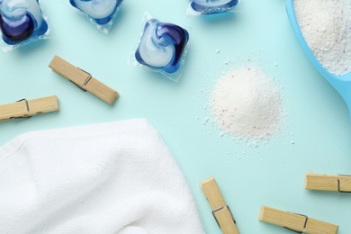 Photo of Flat lay composition with laundry capsules on turquoise background