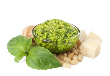 Photo of Composition with bowl of pesto sauce and ingredients isolated on white