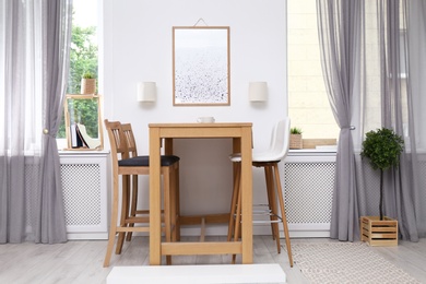 Modern room interior with wooden dining table