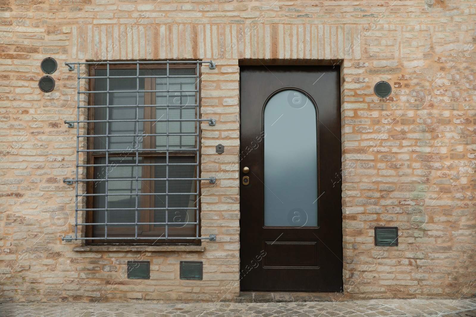 Photo of Beautiful building with wooden door on city street