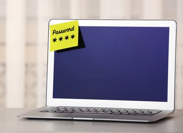 Image of Sticky note with password on laptop indoors. Space for text