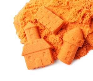 Castle figures made of orange kinetic sand isolated on white, top view
