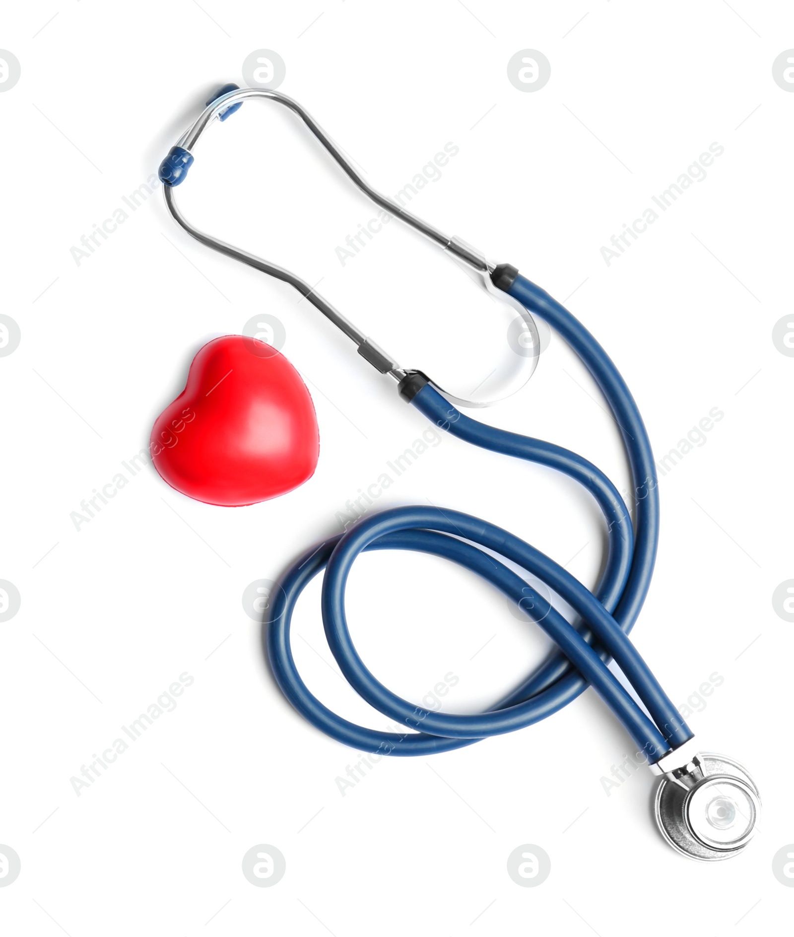 Photo of Stethoscope and heart model on light background, top view. Medical equipment