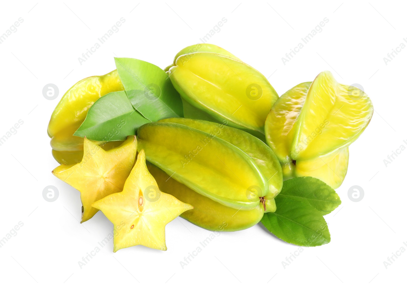 Photo of Cut and whole carambolas with green leaves on white background