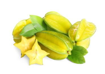 Photo of Cut and whole carambolas with green leaves on white background