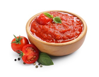 Photo of Homemade tomato sauce in bowl and fresh ingredients isolated on white
