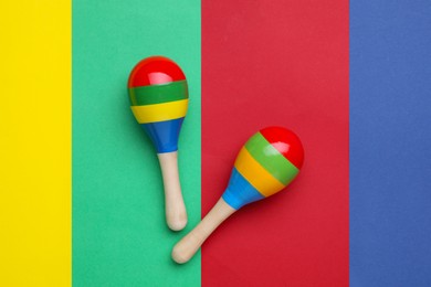 Maracas on colorful background, flat lay. Musical instrument