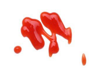 Photo of Tasty ketchup smear isolated on white, top view. Tomato sauce
