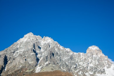 Photo of Picturesque view of beautiful high mountain under blue sky on sunny day