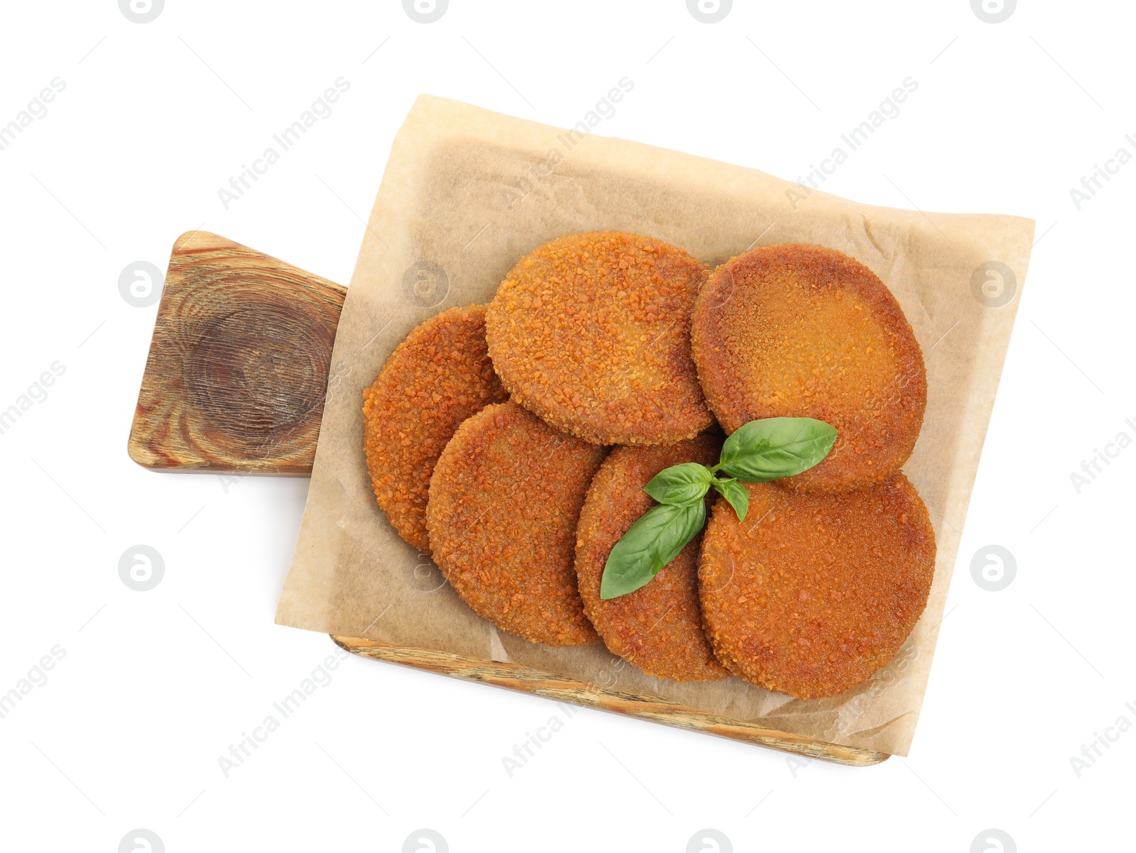 Photo of Delicious fried breaded cutlets with basil leaves isolated on white, top view