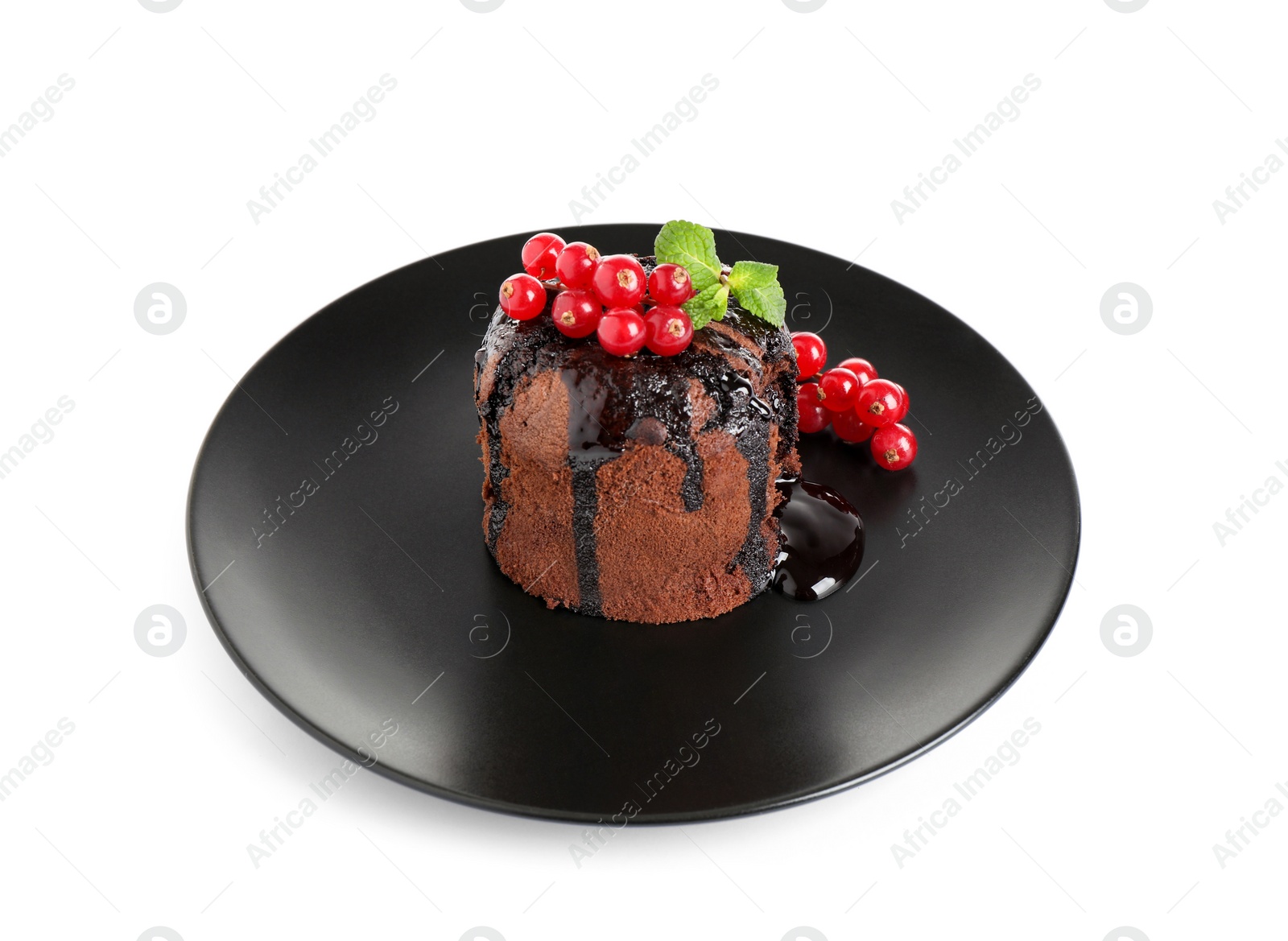 Photo of Delicious warm chocolate lava cake with mint and berries isolated on white