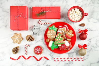 Flat lay composition with tasty homemade Christmas cookies on table, top view