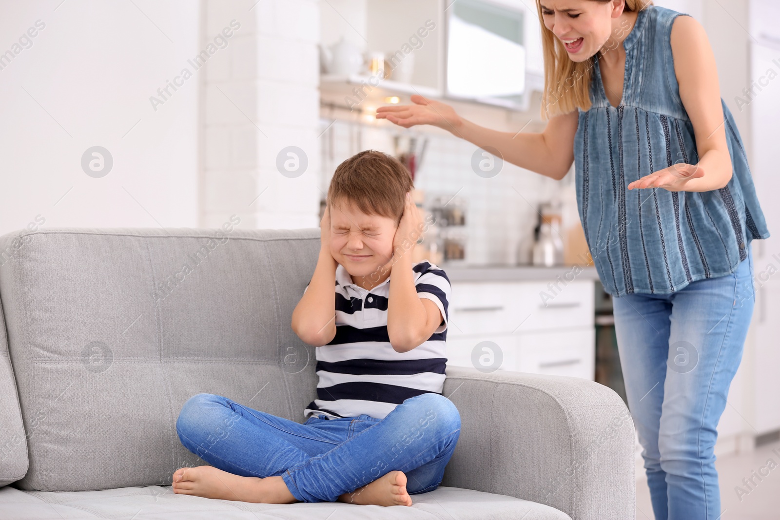 Photo of Mother arguing with son at home