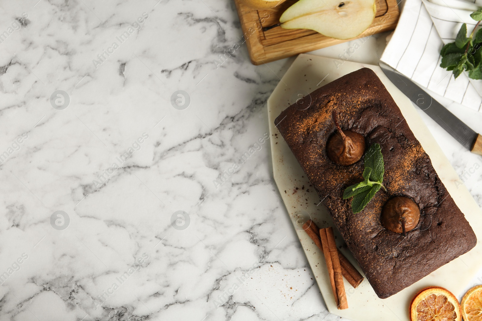 Photo of Flat lay composition with tasty pear bread on white marble table, space for text. Homemade cake