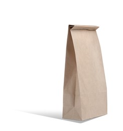 Image of New closed paper bag on white background
