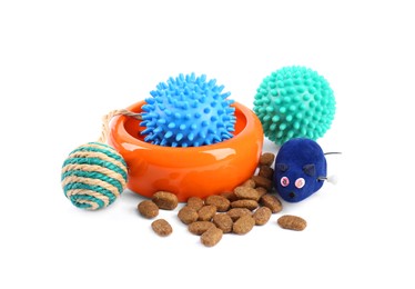 Photo of Pet dry food, bowl and toys on white background. Shop assortment