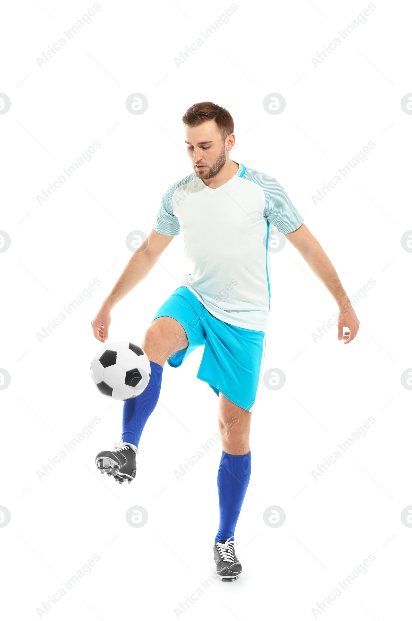 Photo of Young man playing football on white background