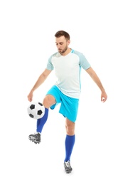 Young man playing football on white background