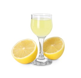 Photo of Liqueur glass with tasty limoncello and halves of lemon isolated on white