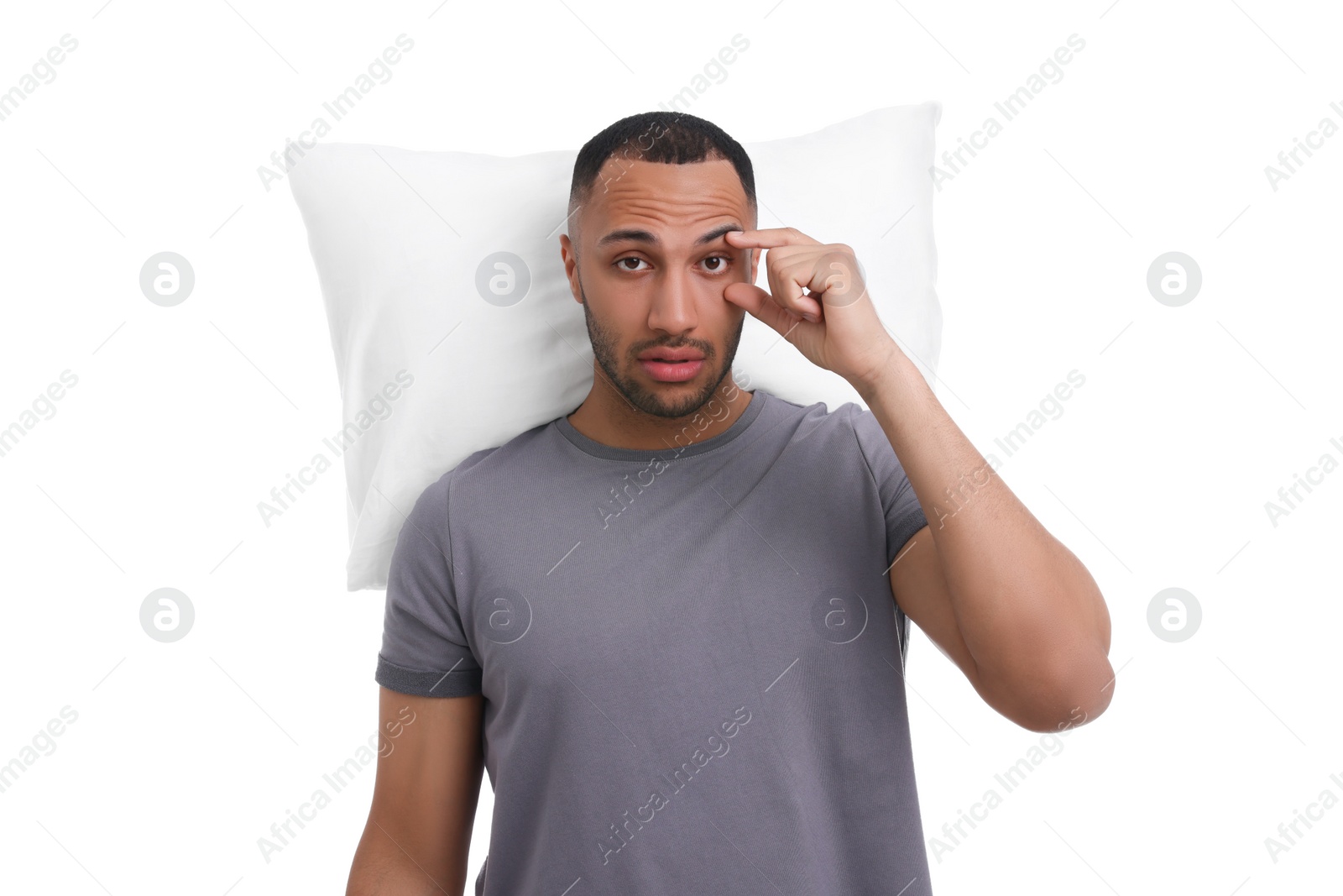 Photo of Tired man with pillow on white background. Insomnia problem