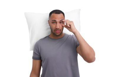 Tired man with pillow on white background. Insomnia problem