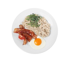 Delicious boiled oatmeal with fried egg, bacon and tomato isolated on white, top view