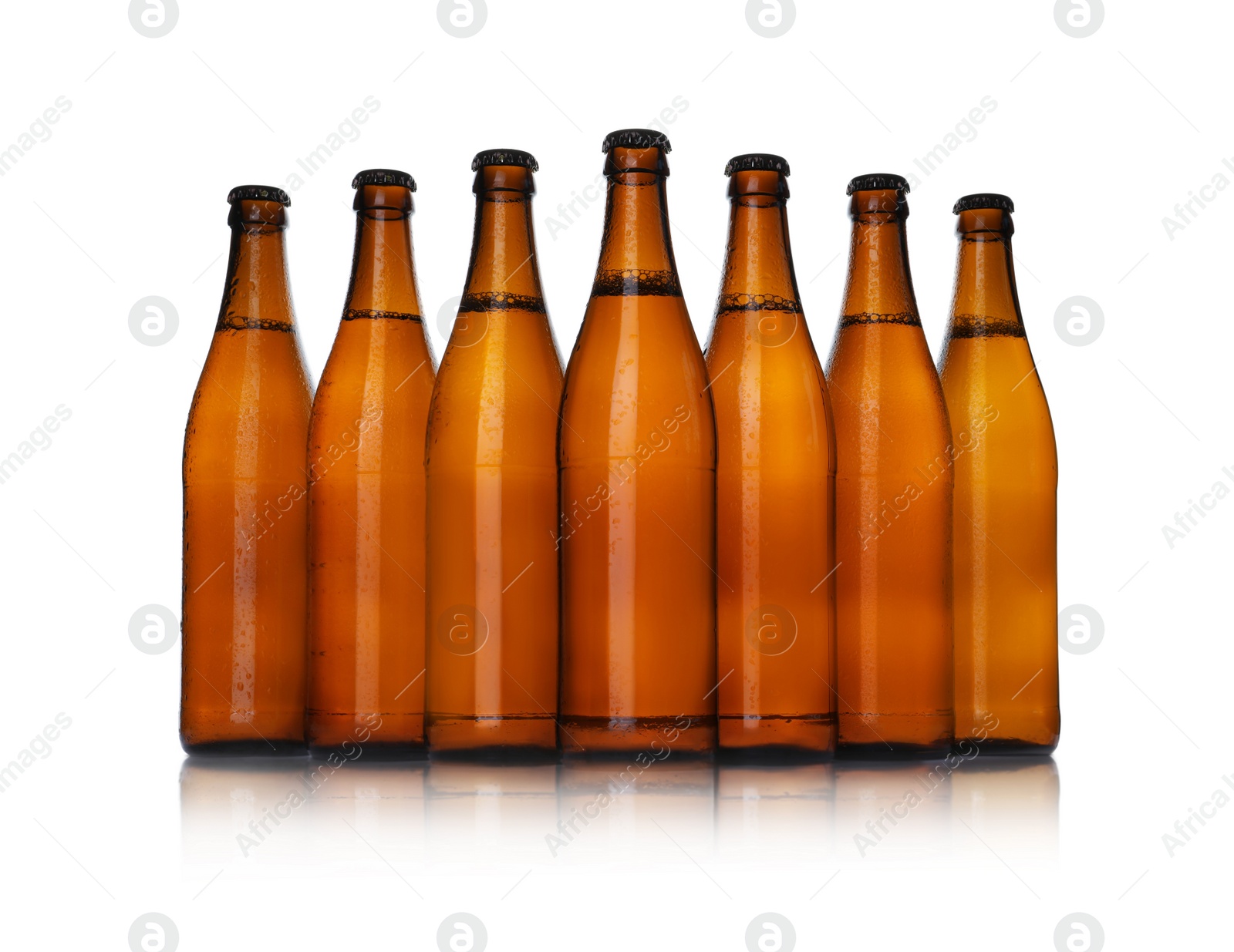 Photo of Brown bottles with beer isolated on white