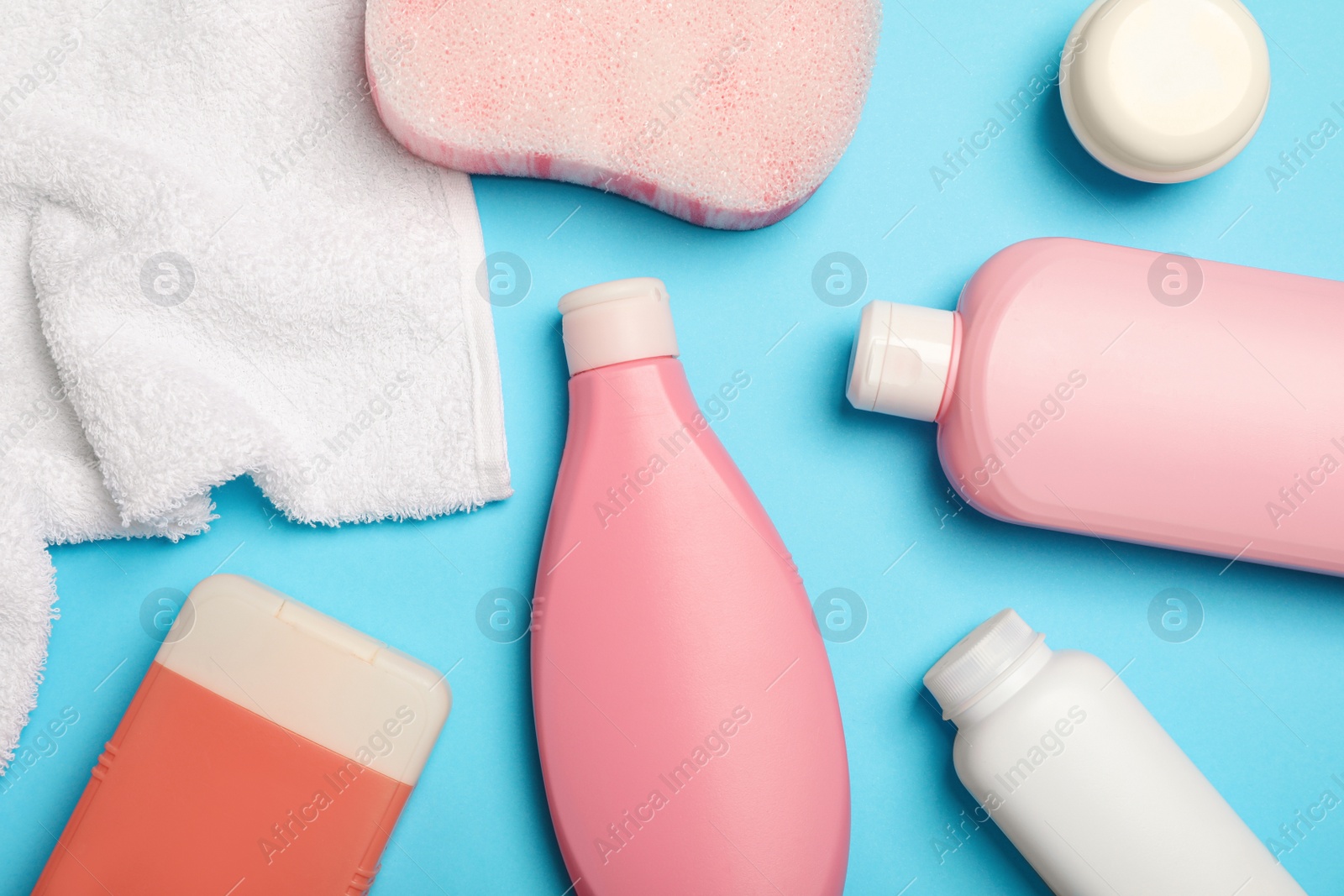 Photo of Flat lay composition with baby cosmetic products on light blue background