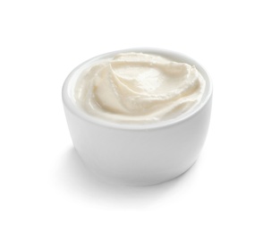 Bowl of tasty cream cheese on white background