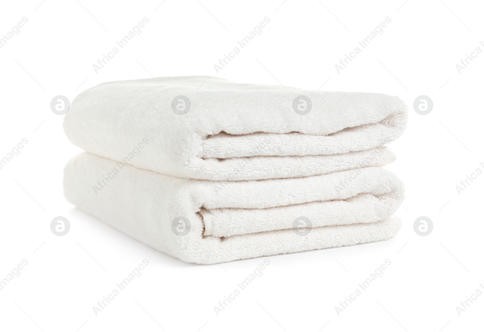 Photo of Folded clean soft towels on white background