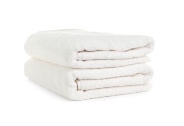 Photo of Folded clean soft towels on white background