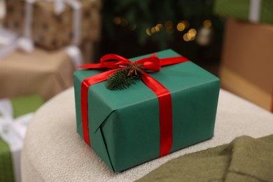 Photo of Christmas present. Gift box in room, closeup