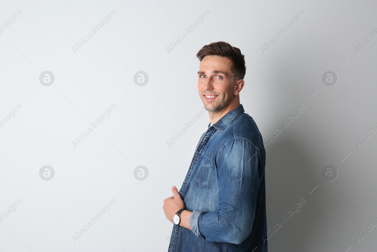 Photo of Portrait of handsome man on light background. Space for text