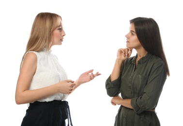 Photo of Young women in casual clothes talking on white background