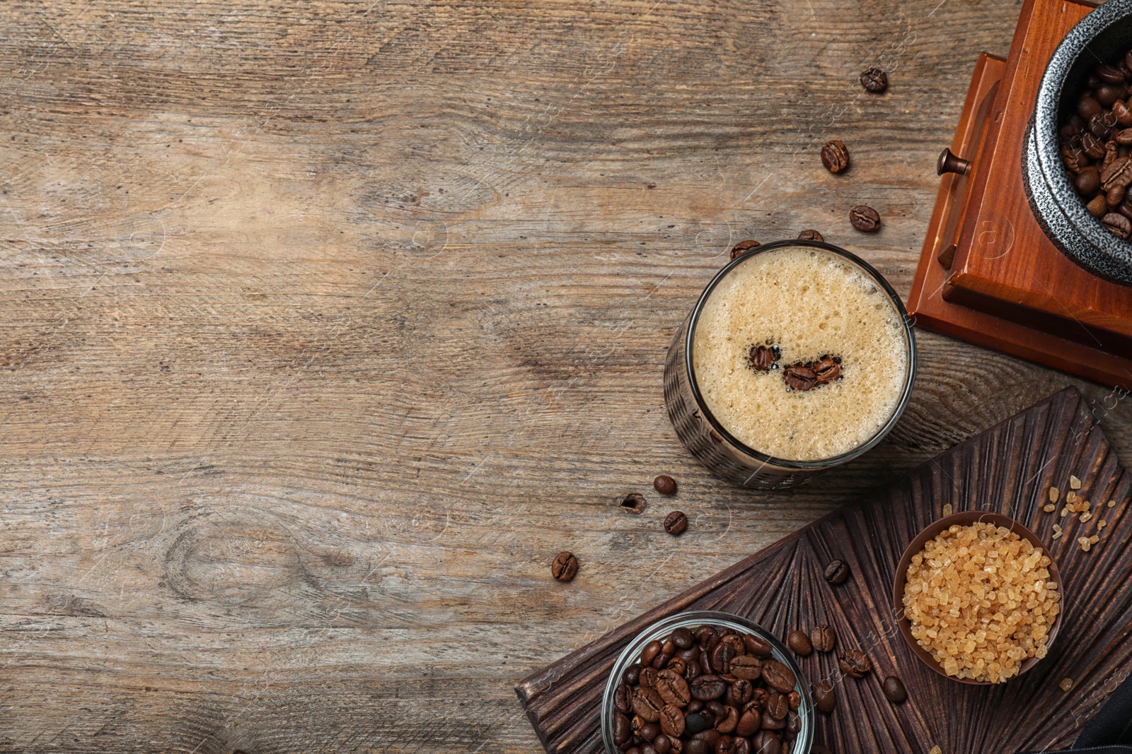 Photo of Flat lay composition with delicious coffee cocktail on wooden table. Space for text