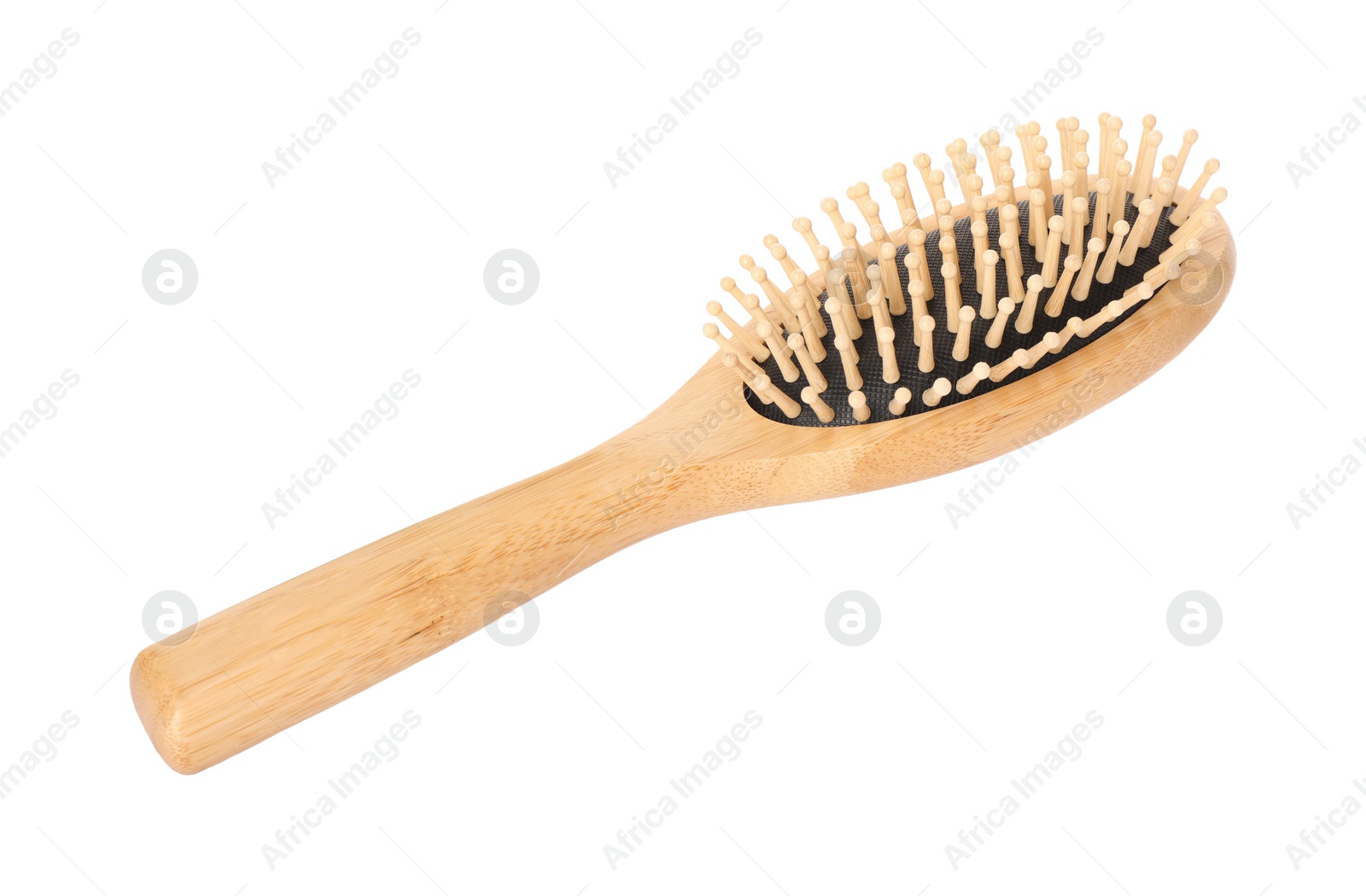 Photo of One new wooden hairbrush isolated on white