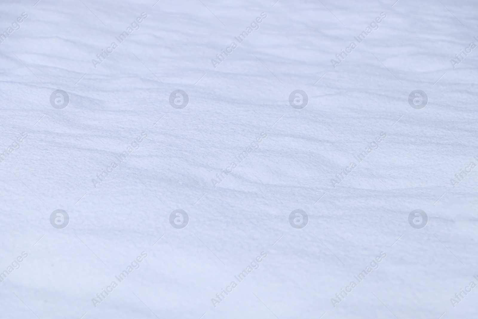 Photo of Beautiful shiny snow as background, closeup view