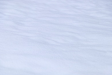 Photo of Beautiful shiny snow as background, closeup view