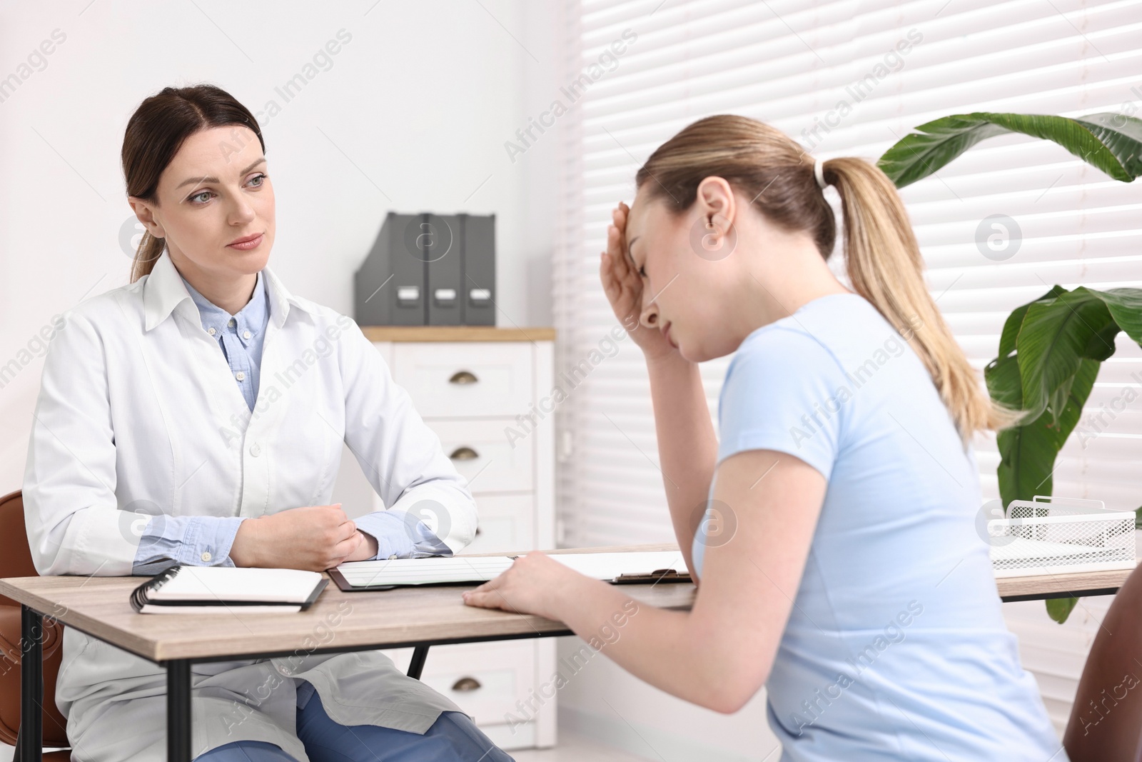 Photo of Mammologist's appointment. Doctor and woman in hospital