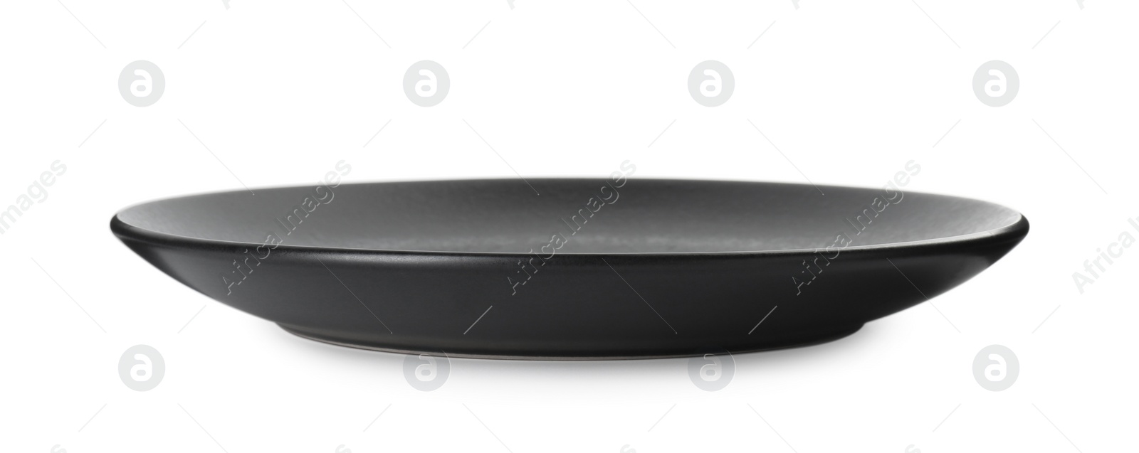 Photo of One beautiful black plate isolated on white