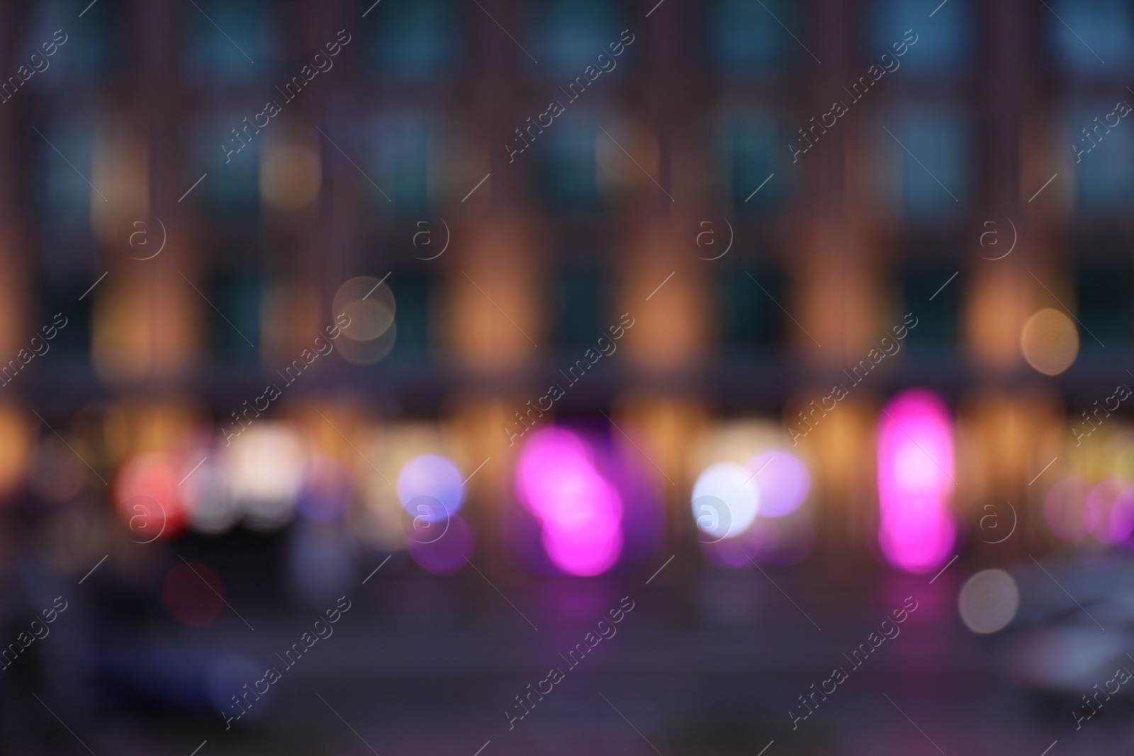 Photo of Blurred view of modern city at evening. Bokeh effect