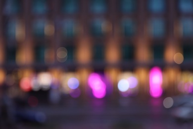 Photo of Blurred view of modern city at evening. Bokeh effect