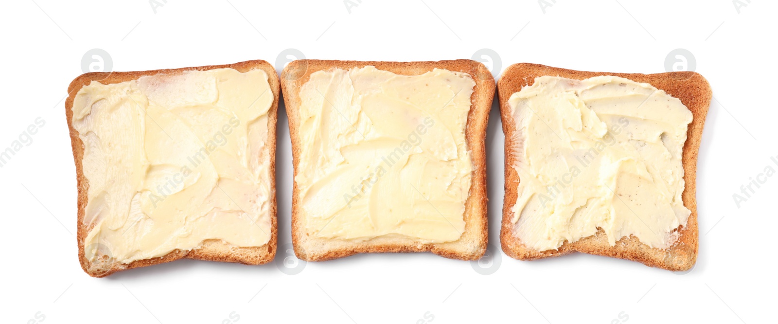 Photo of Tasty toasts with butter on white background, top view