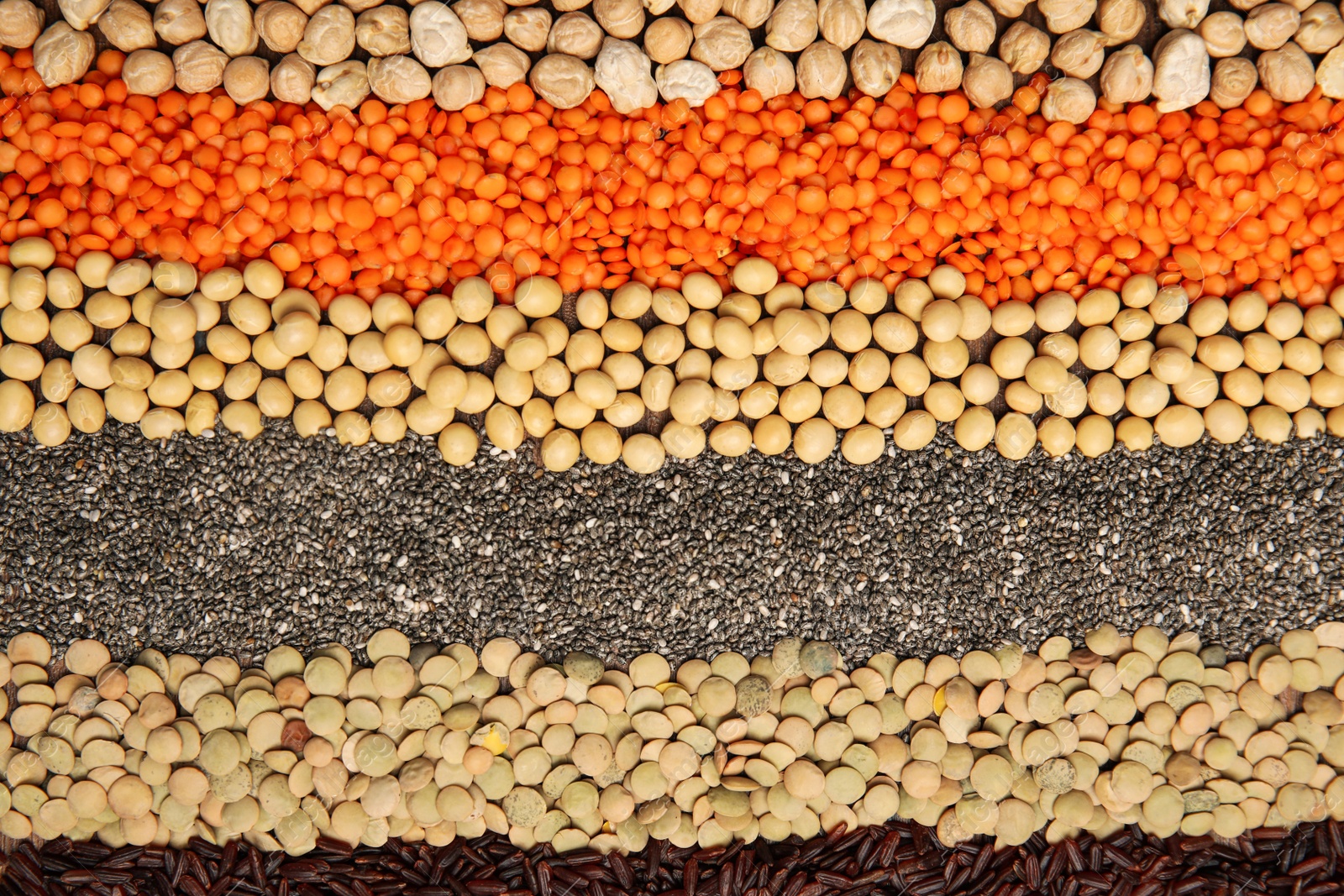 Photo of Different grains and seeds as background, top view. Veggie diet