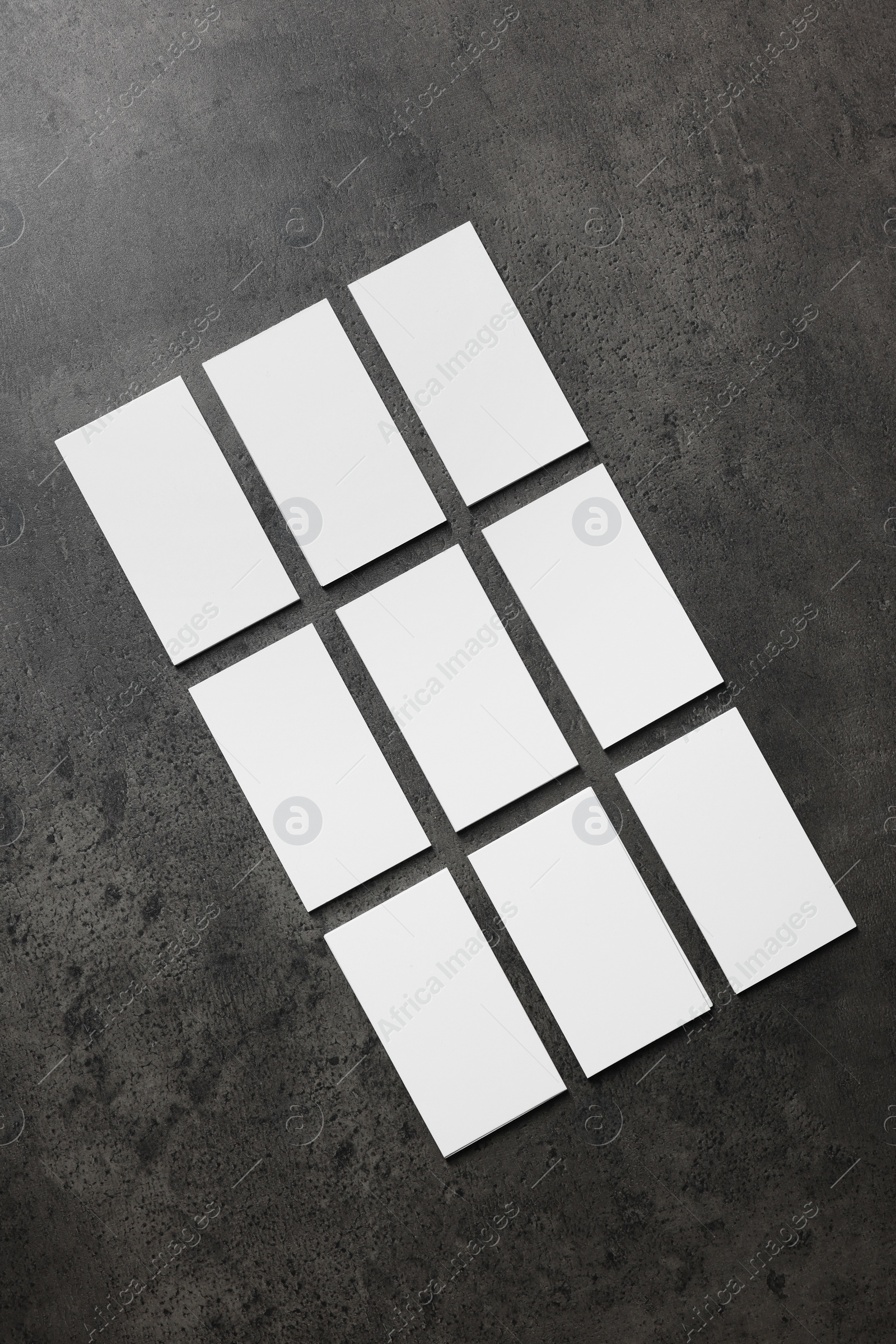 Photo of Blank business cards on grey textured background, top view. Mockup for design