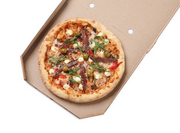Photo of Tasty pizza with anchovies, arugula and olives in cardboard box isolated on white, top view