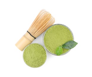 Bamboo whisk, leaves and bowls with matcha powder isolated on white, top view