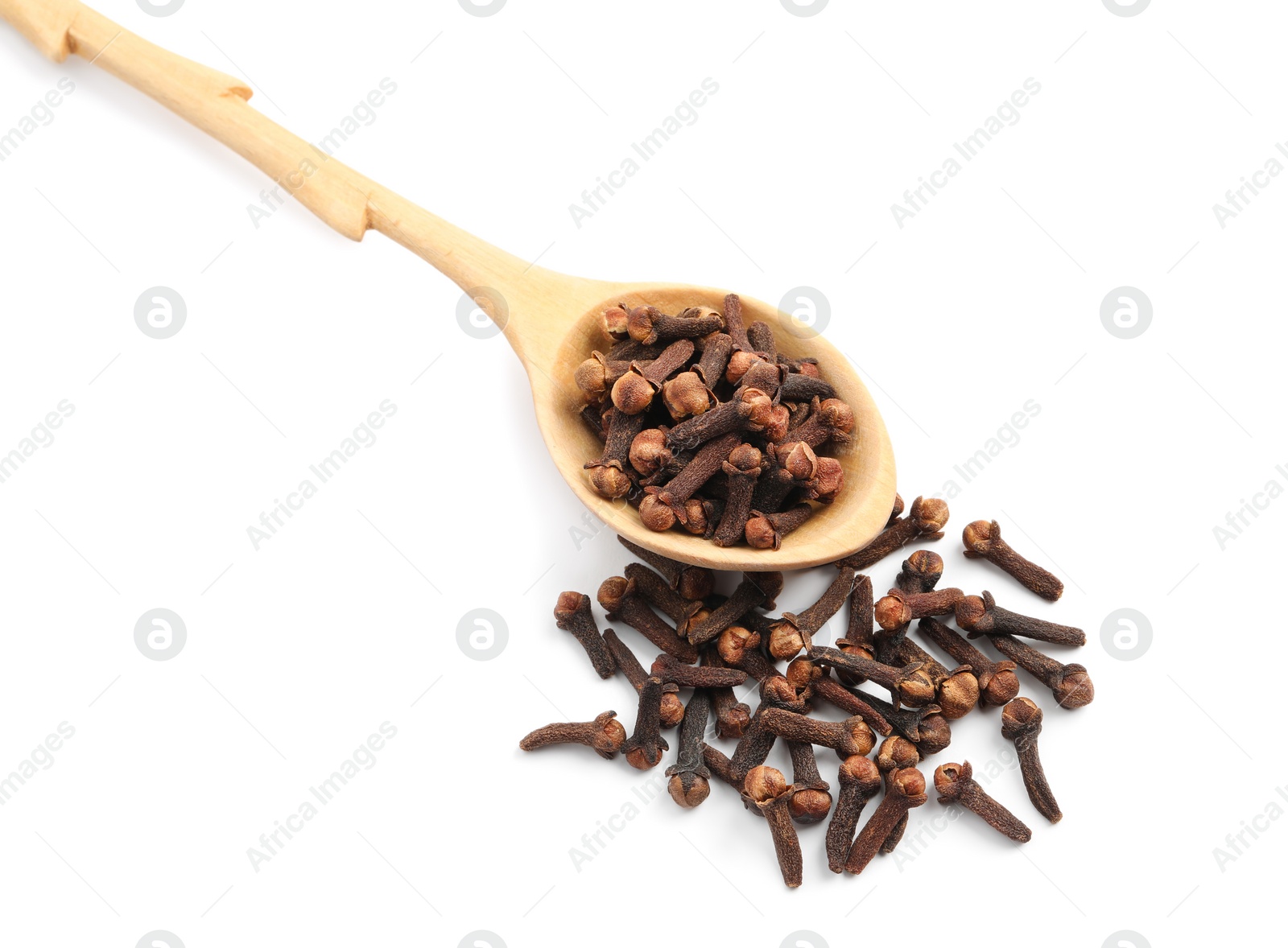 Photo of Pile of aromatic dry cloves and wooden spoon on white background, above view