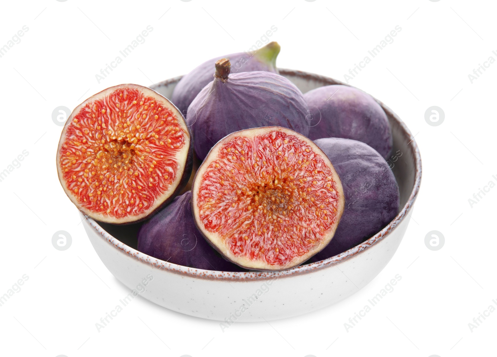 Photo of Whole and cut fresh purple figs in bowl isolated on white