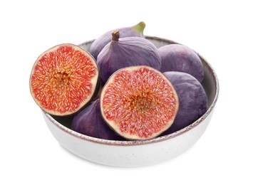 Photo of Whole and cut fresh purple figs in bowl isolated on white